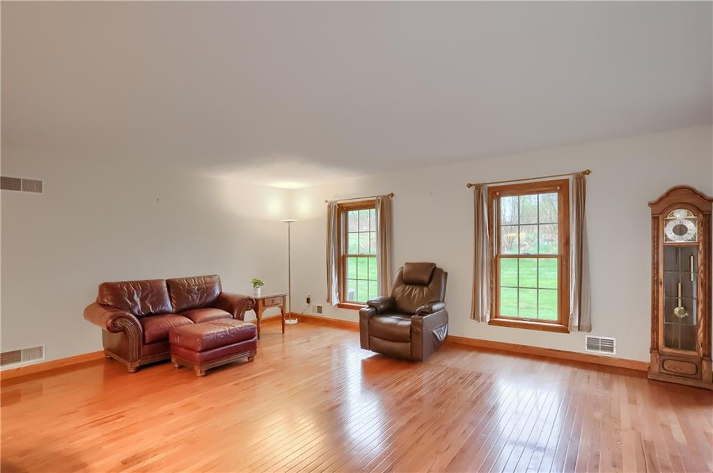 119 South Butler Street Saxonburg, PA 16056 - Photo 18 of 39 a living room with furniture and a wooden floor
