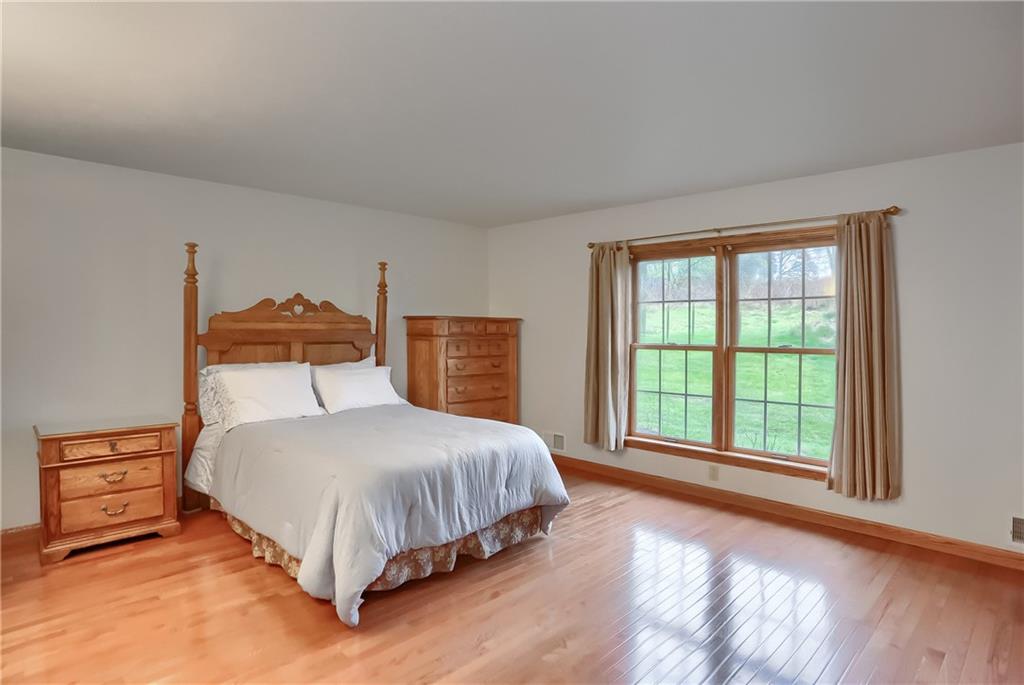 119 South Butler Street Saxonburg, PA 16056 - Photo 23 of 39 a bedroom with a bed and a large window