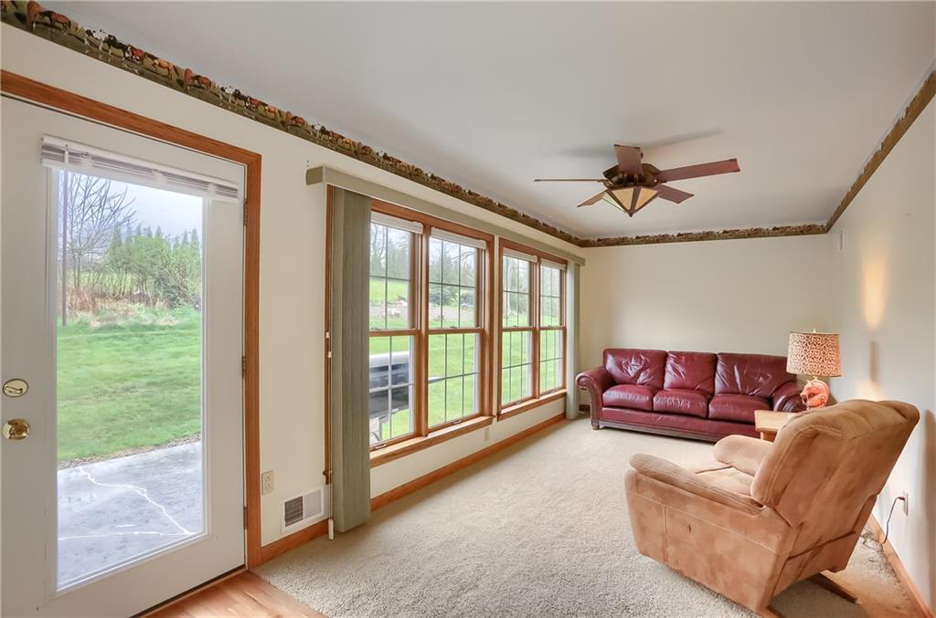 119 South Butler Street Saxonburg, PA 16056 - Photo 30 of 39 a living room with furniture and a floor to ceiling window