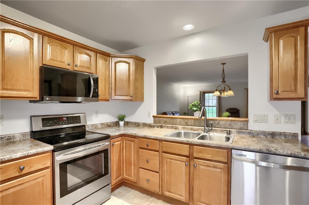 119 South Butler Street Saxonburg, PA 16056 - Photo 7 of 39 a kitchen with a sink stove and microwave
