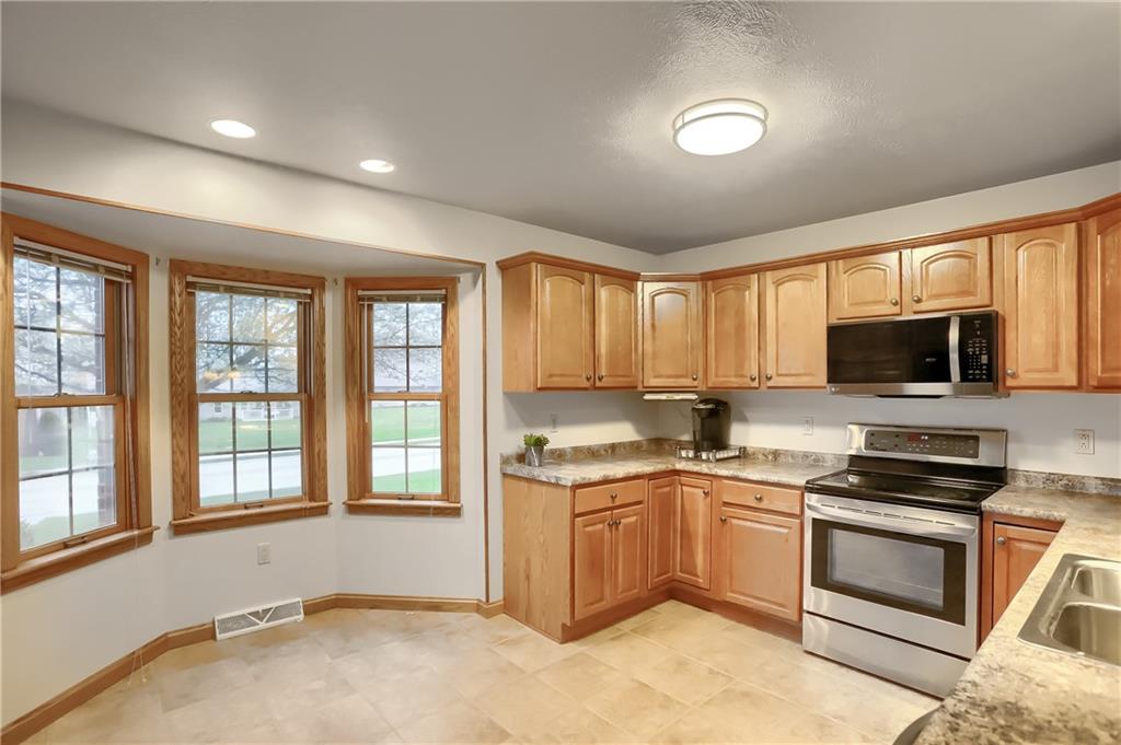 119 South Butler Street Saxonburg, PA 16056 - Photo 8 of 39 a kitchen with a sink stove top oven and refrigerator