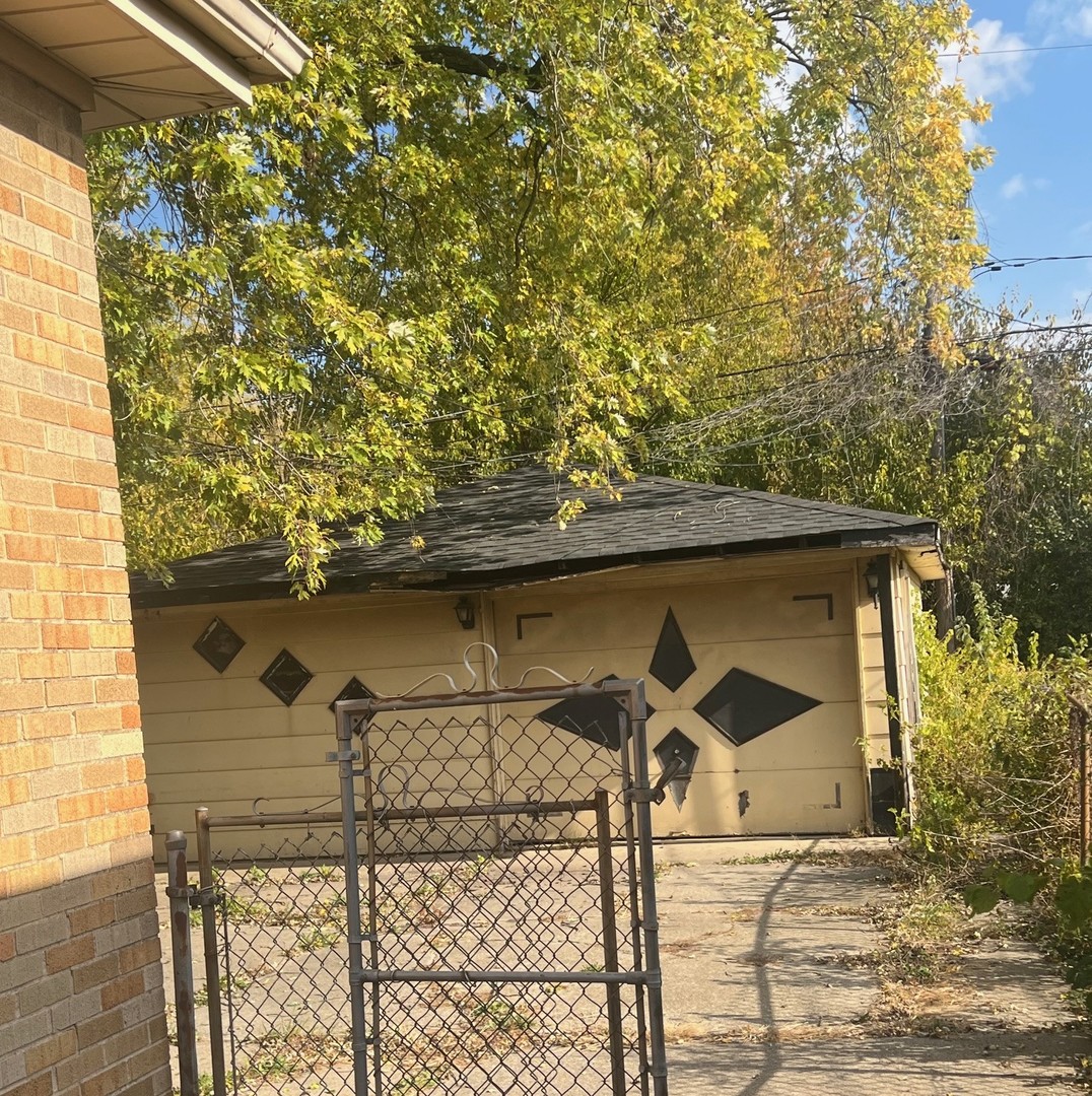 14425 Vail Avenue Harvey, IL 60426 - Photo 5 of 16 a front view of a house with parking area