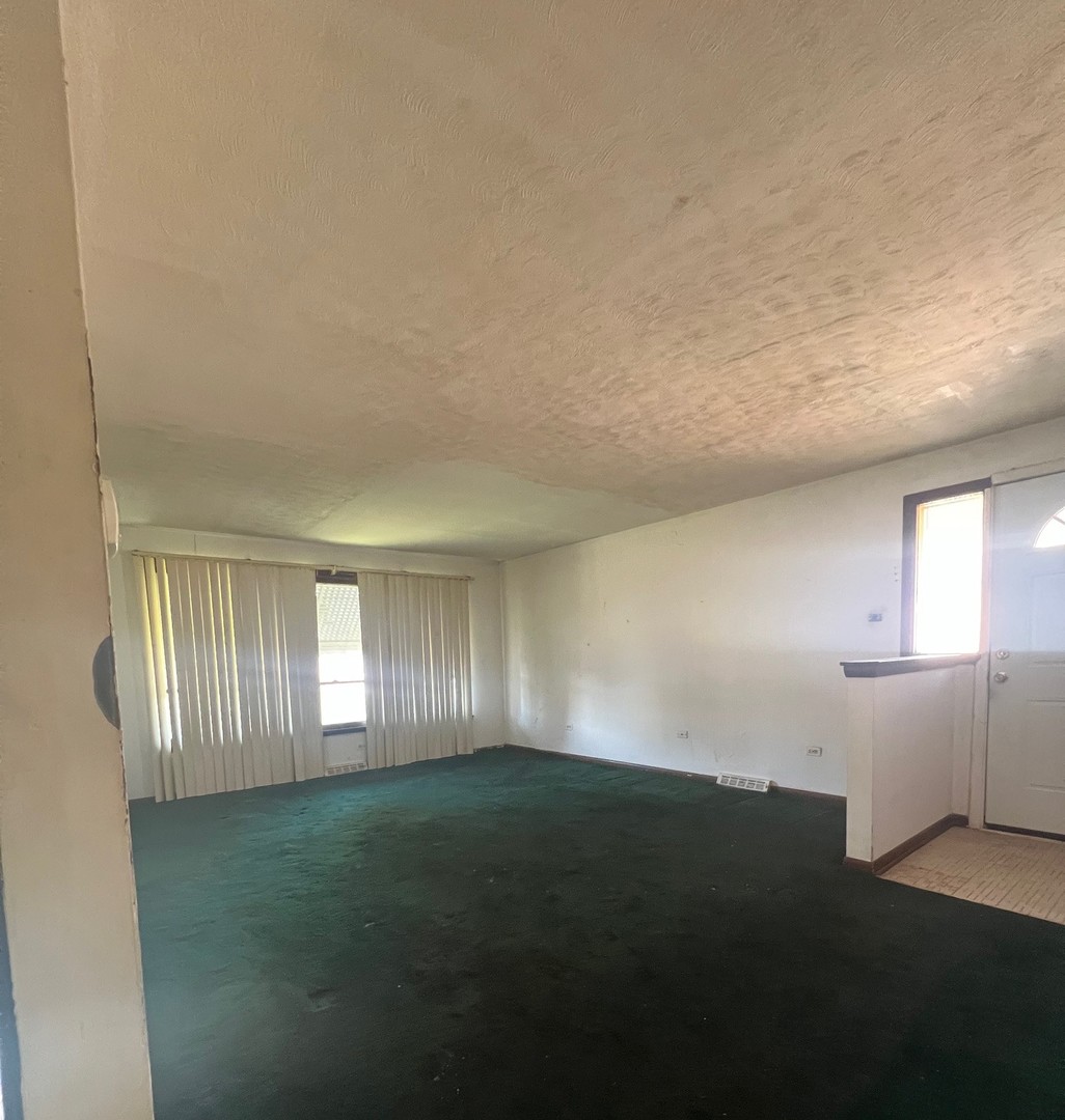 14425 Vail Avenue Harvey, IL 60426 - Photo 8 of 16 an empty room with windows