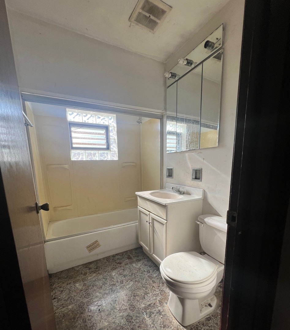 14425 Vail Avenue Harvey, IL 60426 - Photo 10 of 16 a bathroom with a sink a toilet and shower