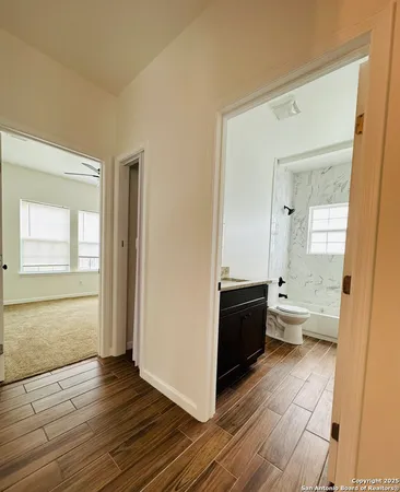 a large living room with a wooden floor