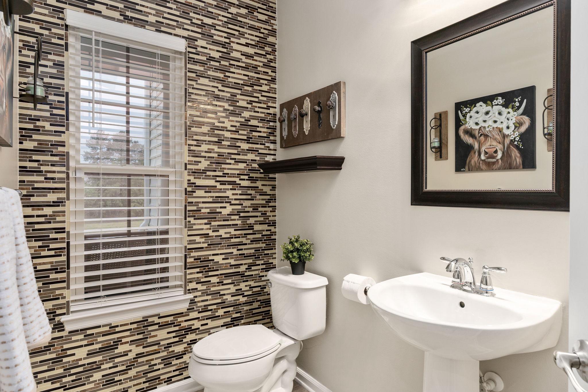 9417 Reservoir Road Fredericksburg, VA 22407 - Photo 31 of 76 Chic powder room with stylish accents.