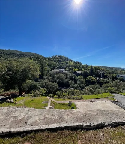 a view of a swimming pool with a yard