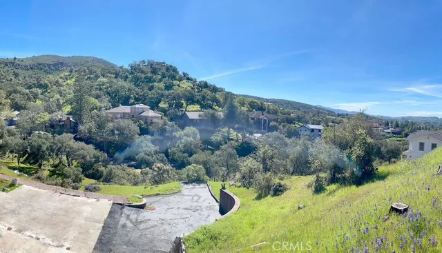 an aerial view of mountain with residential house