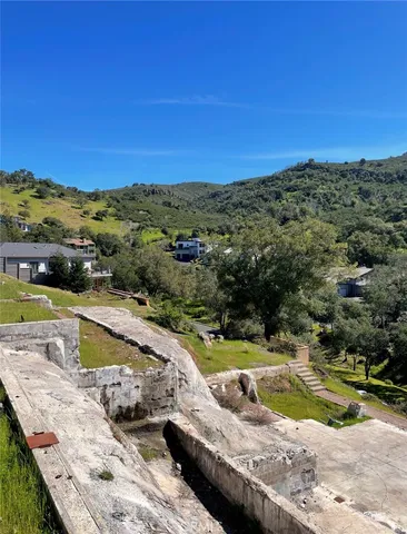 a view of a swimming pool with a lake view