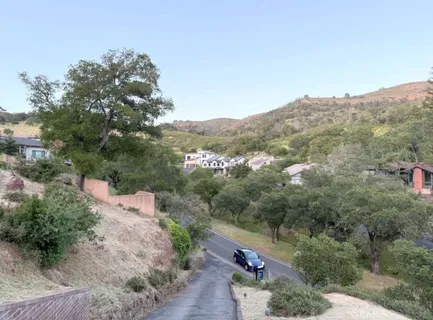 an aerial view of a house with mountain view