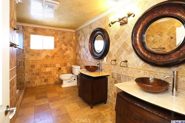 a bathroom with a sink a mirror and a shower