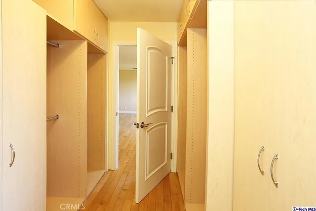 a bathroom with a shower and a glass door