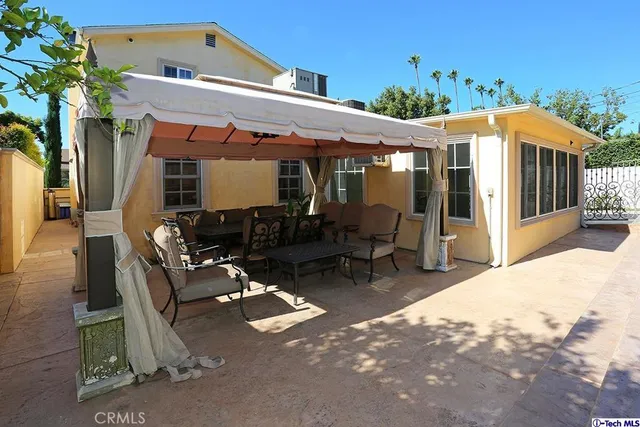 a patio with table and chairs