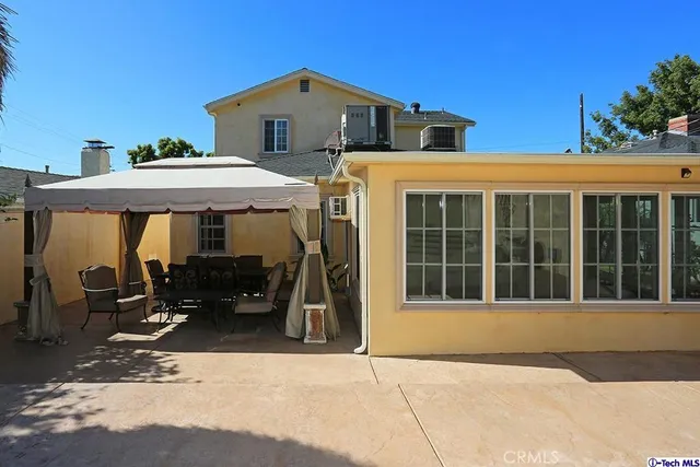 a front view of a house with a patio