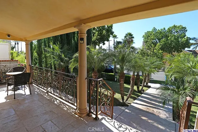 a view of a chairs and table in patio