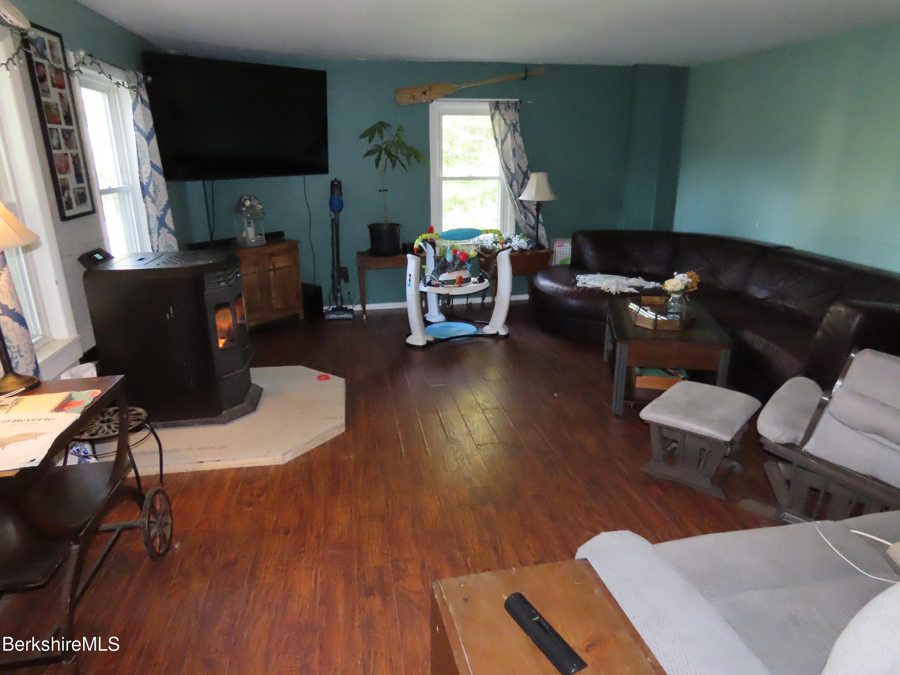 660 E Road Stamford, VT 05352 - Photo 13 of 41 a living room with furniture and a flat screen tv