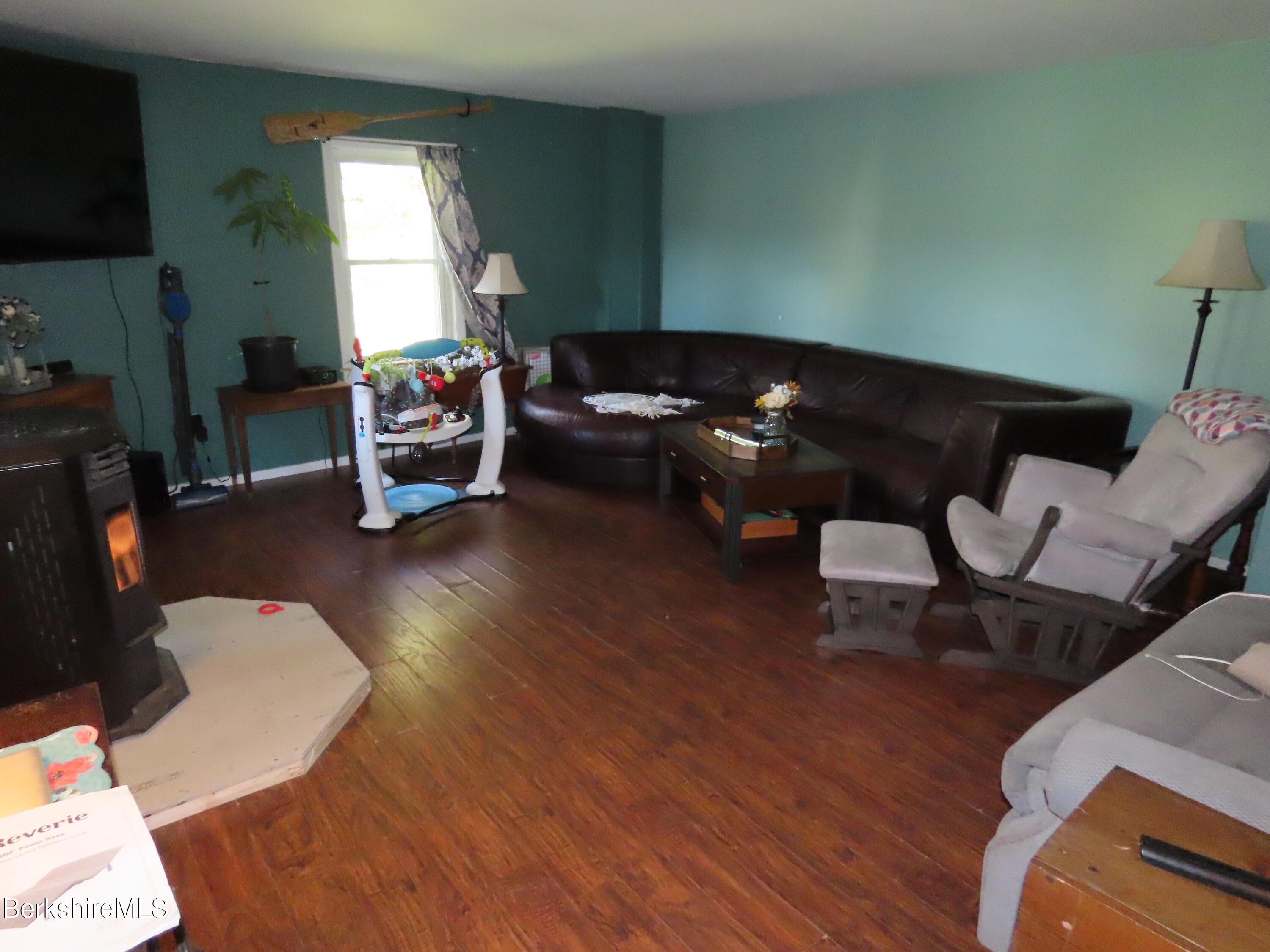 660 E Road Stamford, VT 05352 - Photo 14 of 41 a living room with furniture and a window