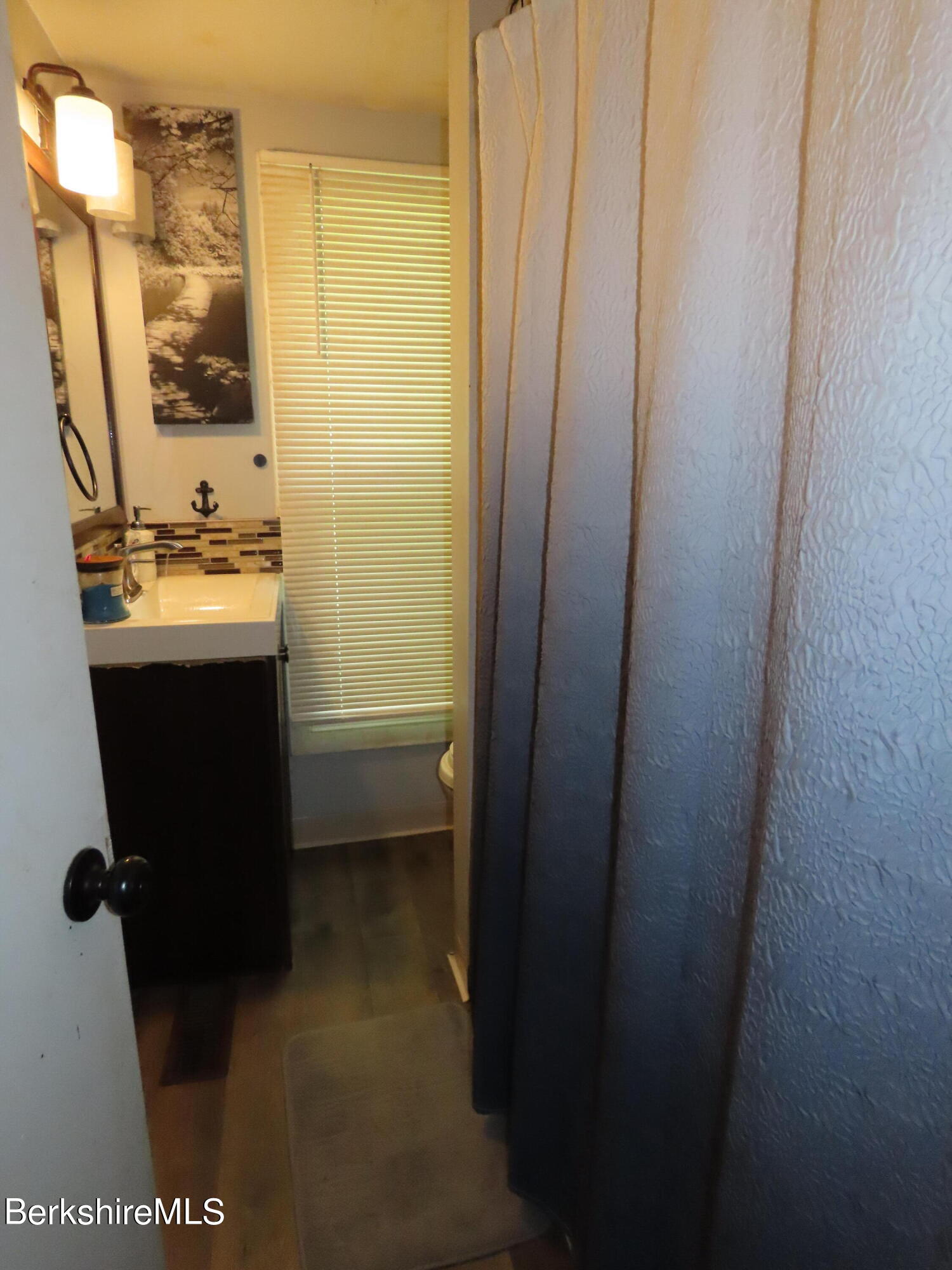 660 E Road Stamford, VT 05352 - Photo 23 of 41 a view of bathroom with a sink and mirror