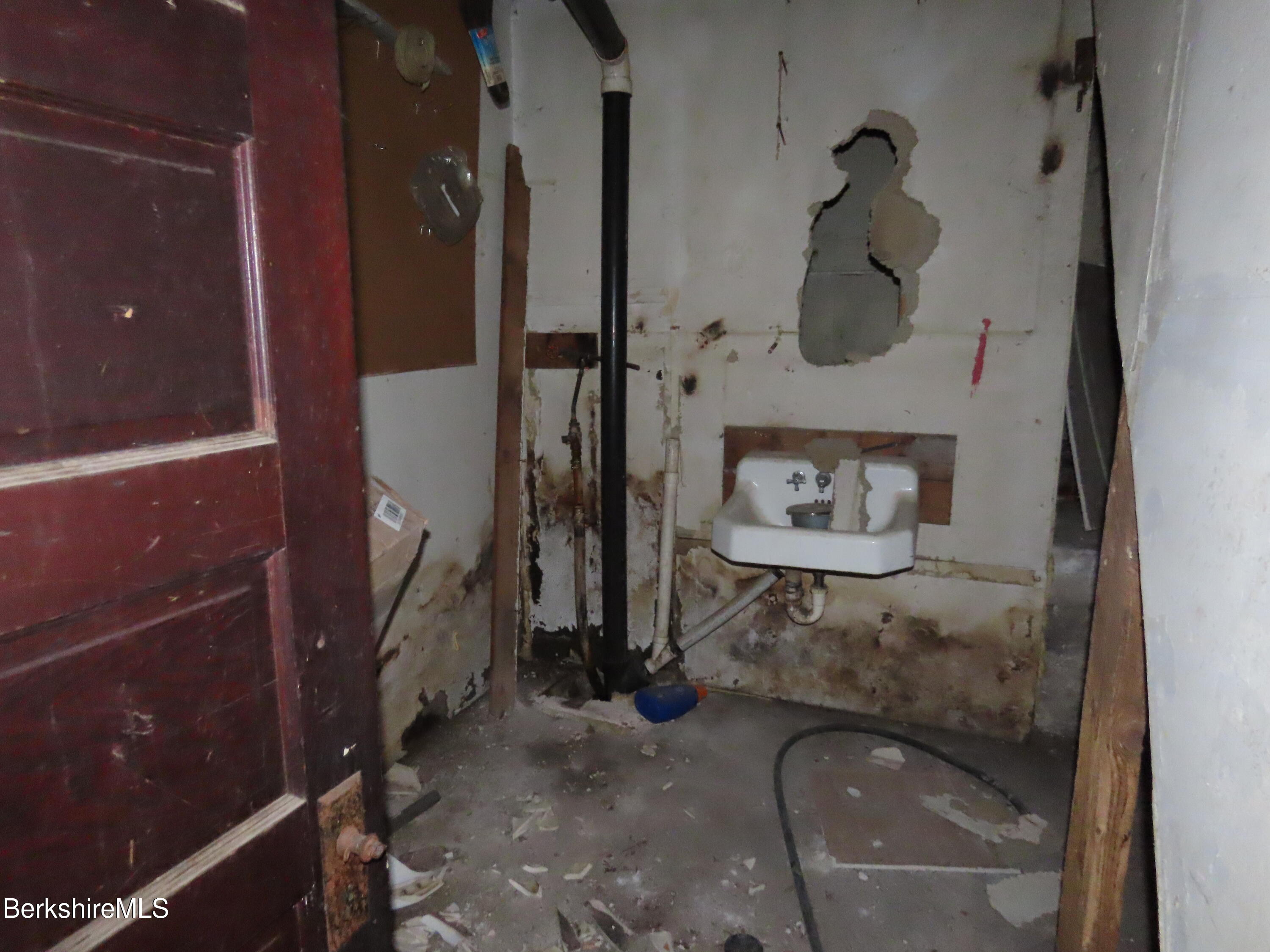 660 E Road Stamford, VT 05352 - Photo 27 of 41 a bathroom with a granite countertop shower a mirror and vanity