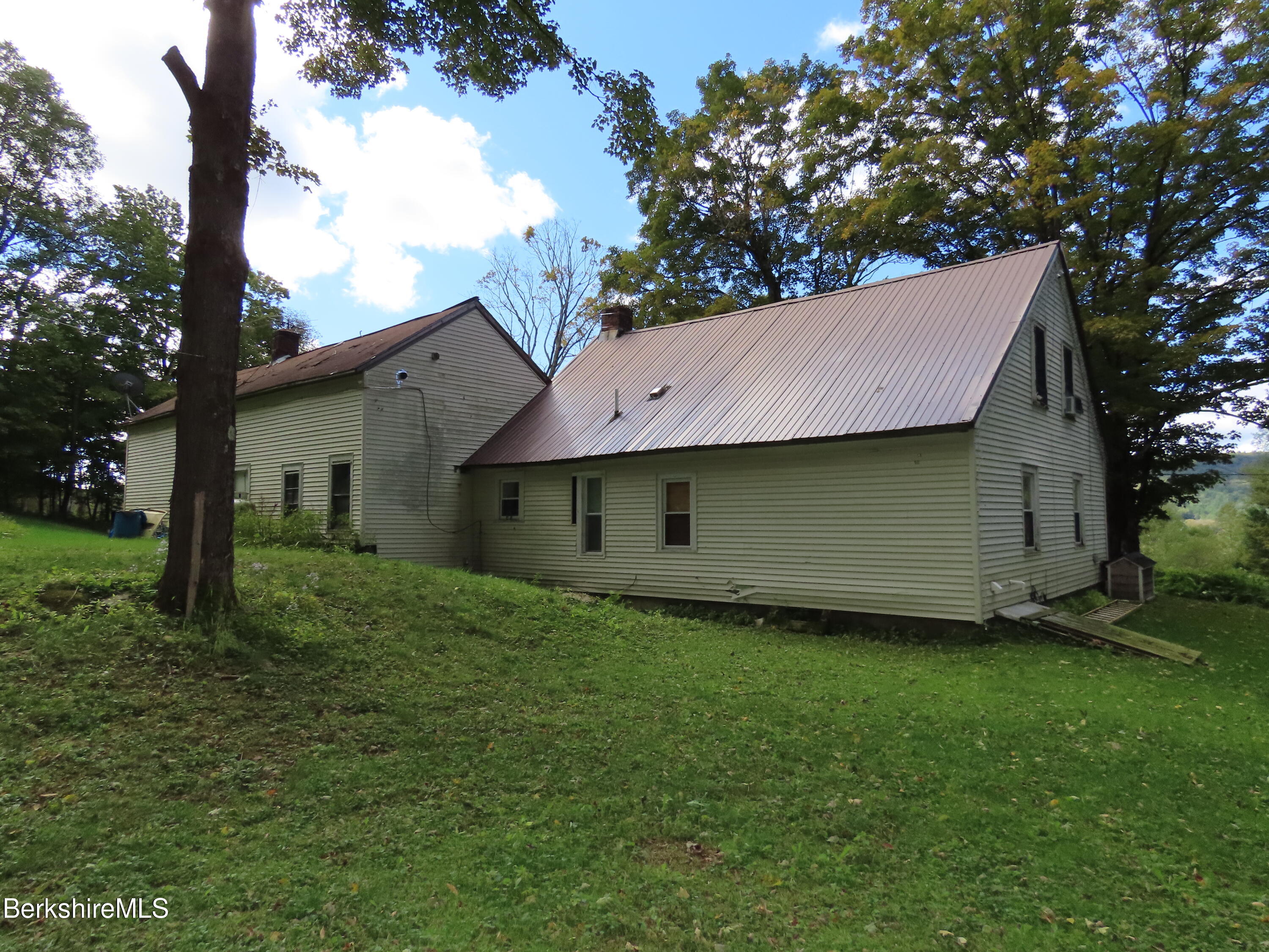 660 E Road Stamford, VT 05352 - Photo 38 of 41 a backyard of a house with table and chairs