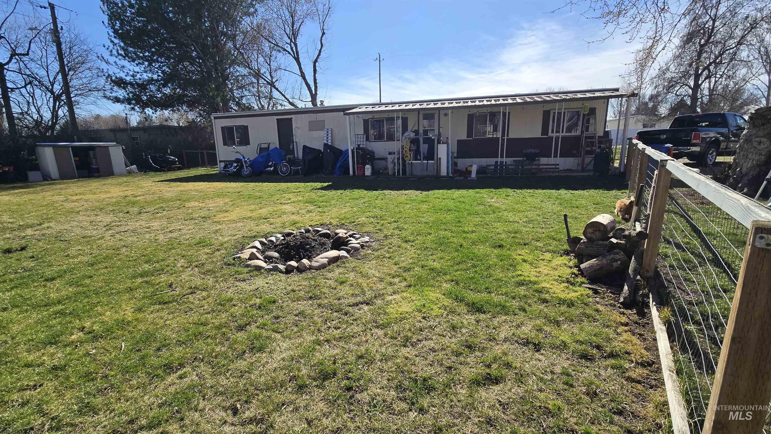 798 Dolson Lane Eagle, ID 83616 - Photo 1 of 33 Back of house with an outdoor fire pit
