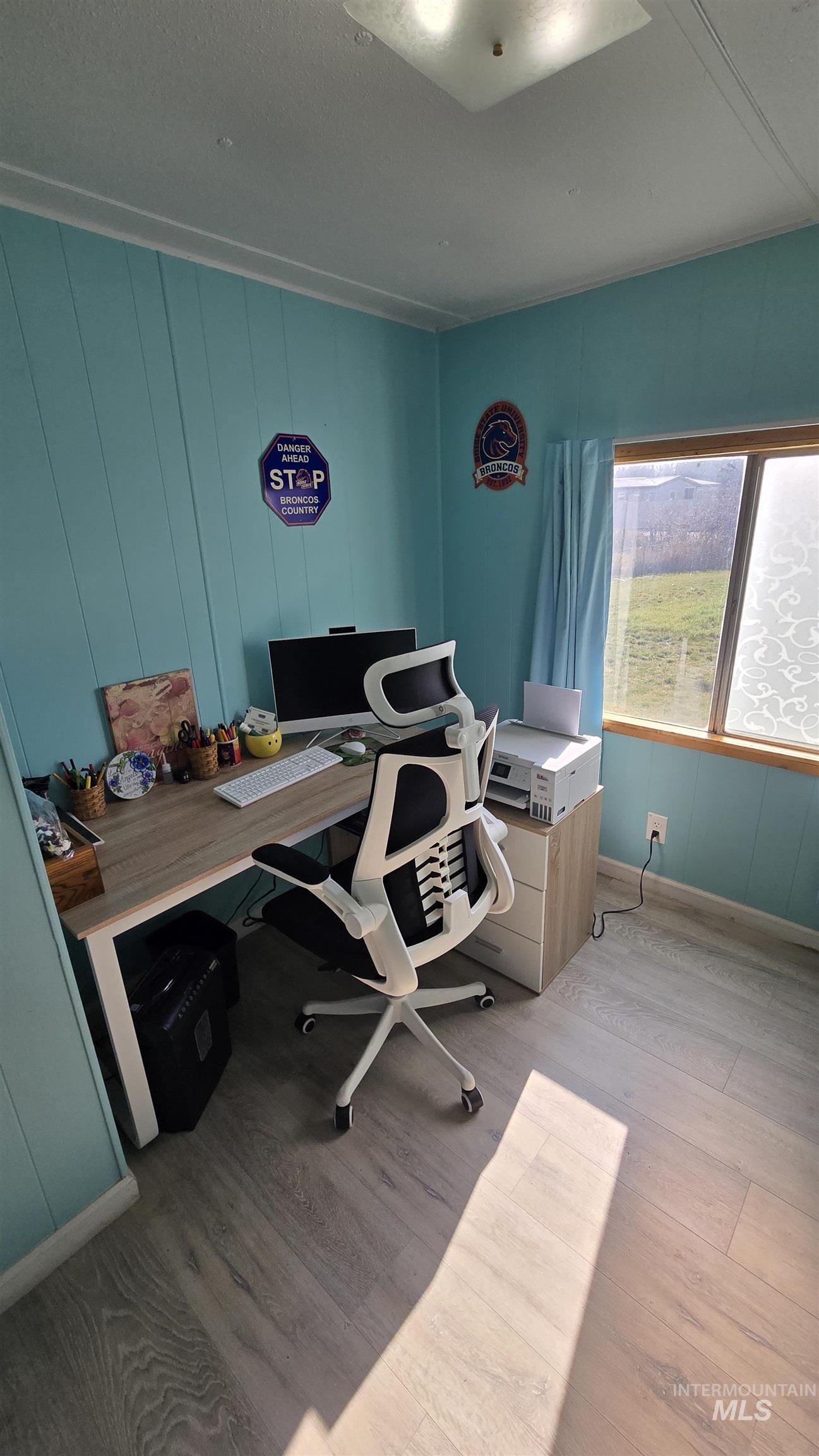 798 Dolson Lane Eagle, ID 83616 - Photo 24 of 33 Home office featuring light wood-style floors and wood walls