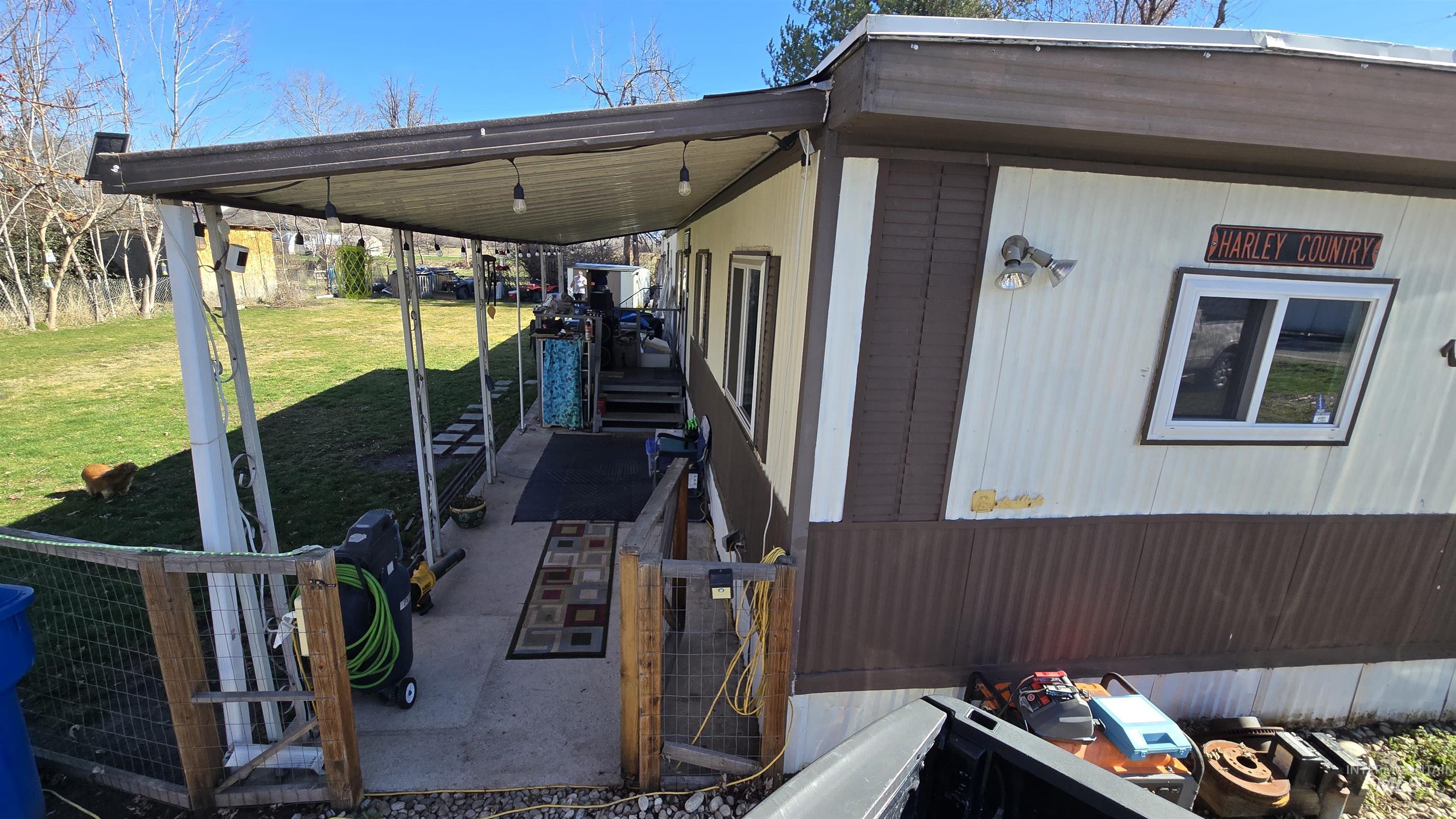 798 Dolson Lane Eagle, ID 83616 - Photo 29 of 33 View of property exterior with a lawn and a carport