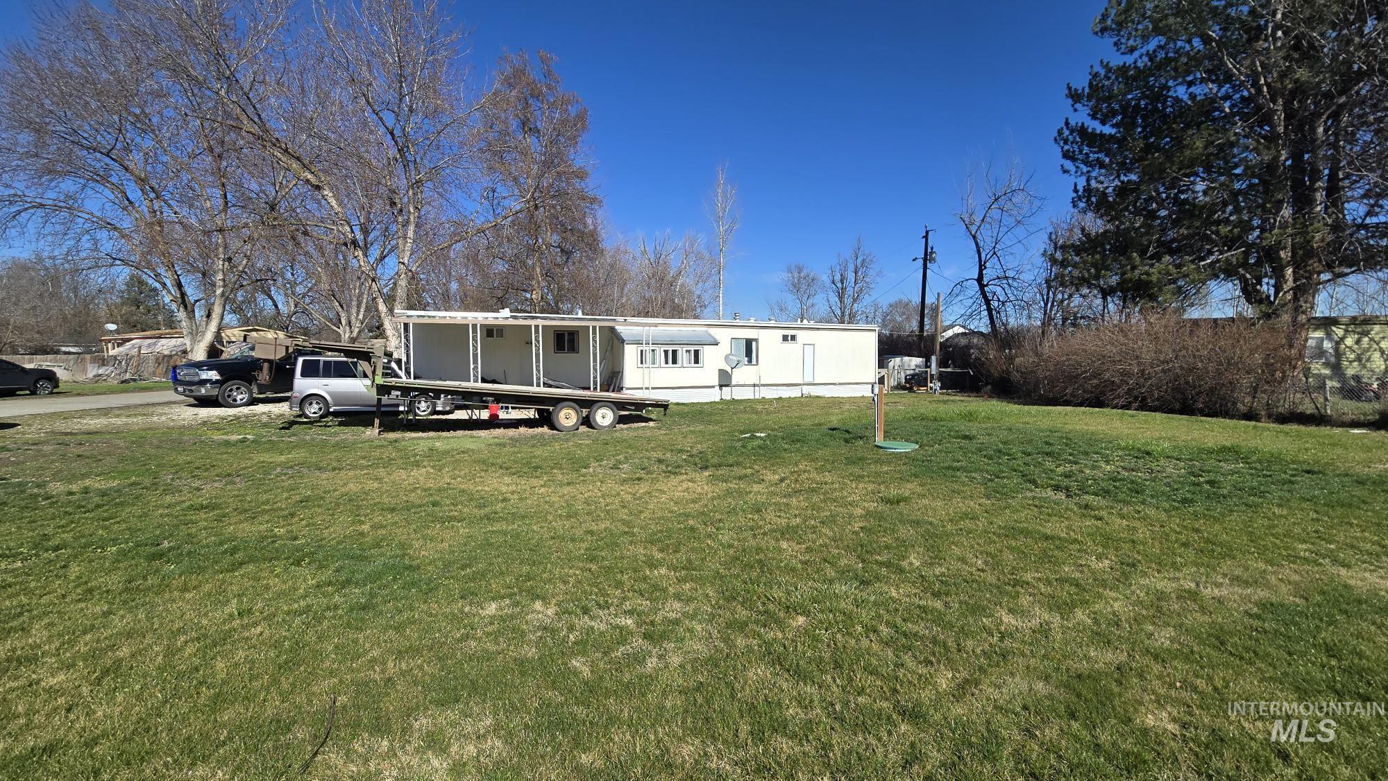 798 Dolson Lane Eagle, ID 83616 - Photo 31 of 33 Manufactured / mobile home featuring a front yard