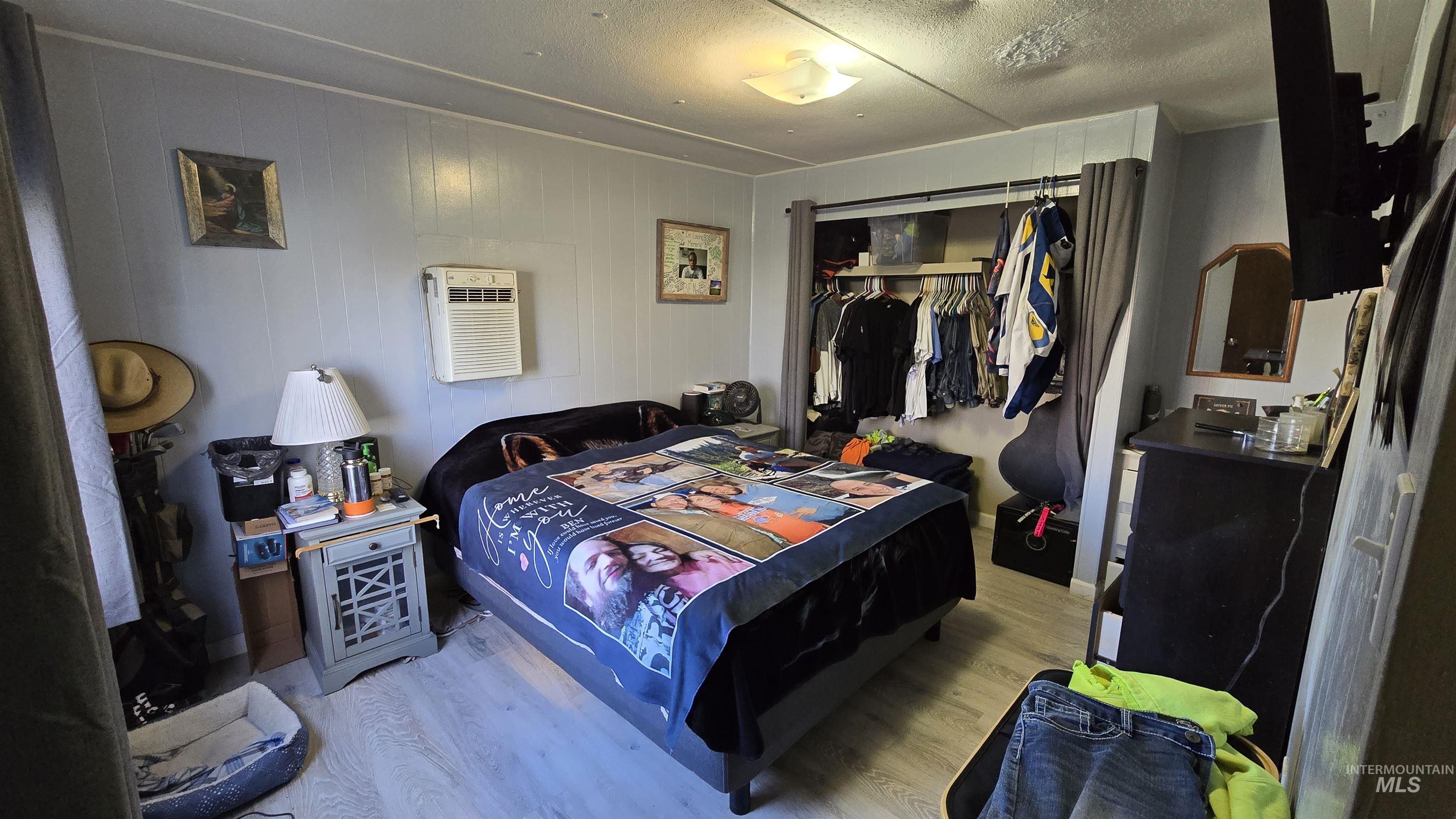 798 Dolson Lane Eagle, ID 83616 - Photo 4 of 33 Bedroom with a closet, light wood-style floors, and a textured ceiling