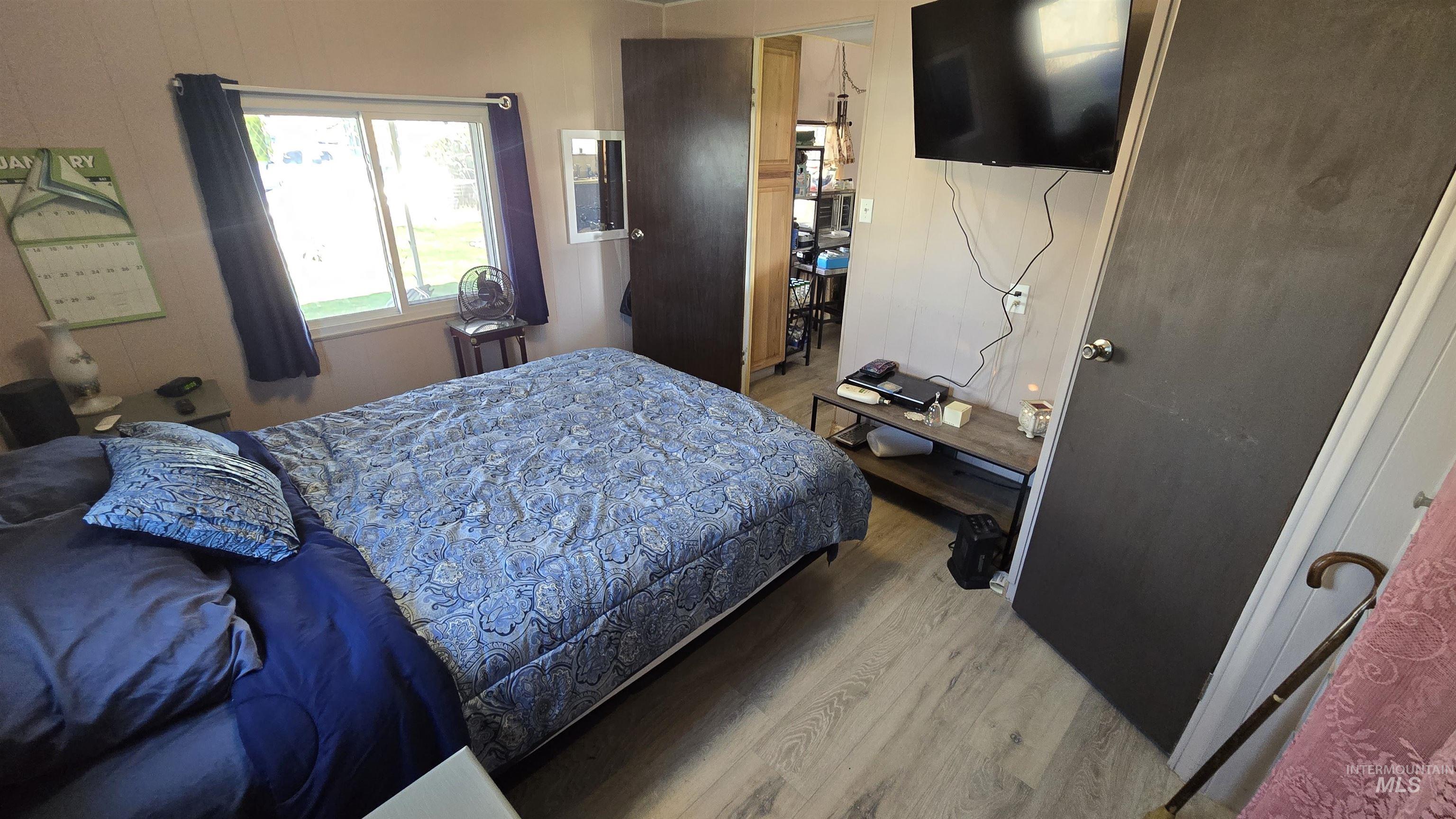 798 Dolson Lane Eagle, ID 83616 - Photo 9 of 33 Bedroom featuring light wood finished floors