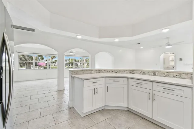 a large bathroom with a lot of counter space and a sink