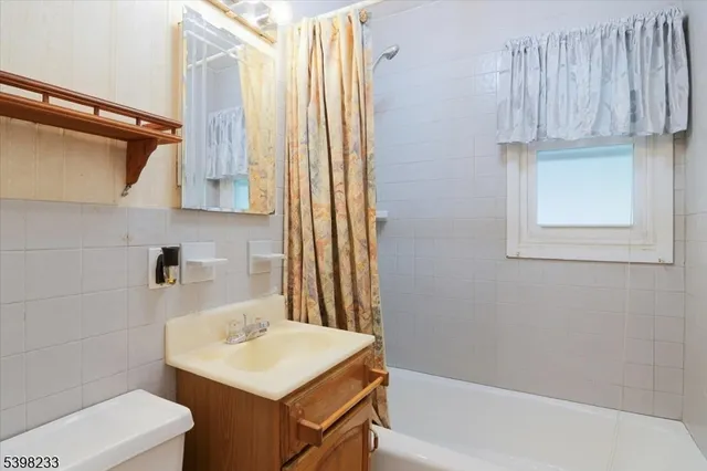 a bathroom with a sink a toilet and a bathtub