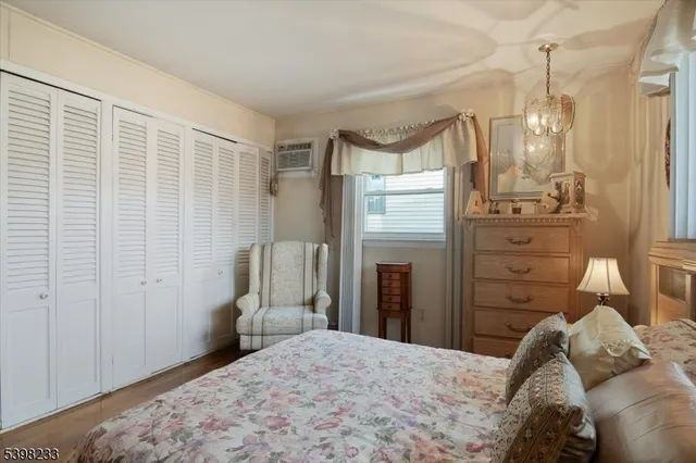 a bedroom with a bed and a mirror