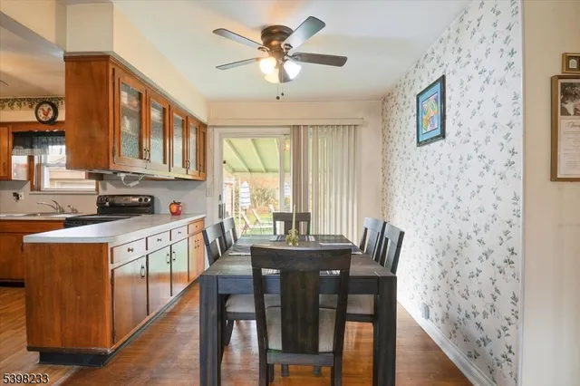 a view of a dining room with furniture window and wooden floor