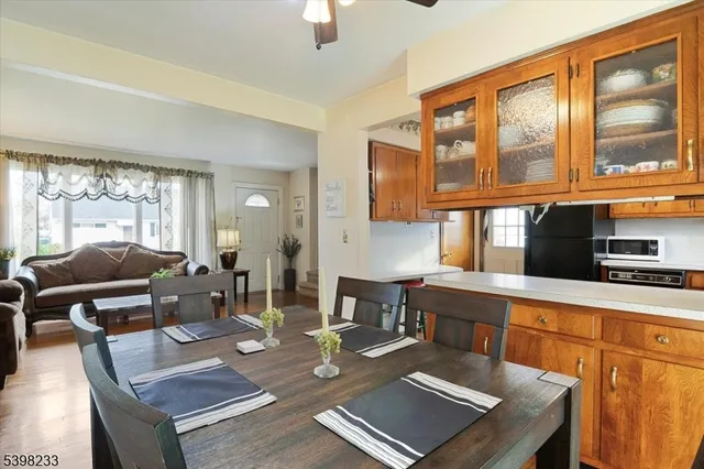 a living room with fireplace furniture and windows