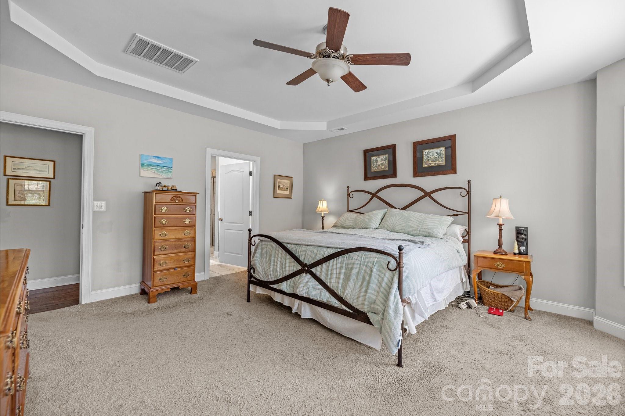 4697 Rinaldo Road York, SC 29745 - Photo 14 of 37 a bedroom with a bed and a chandelier