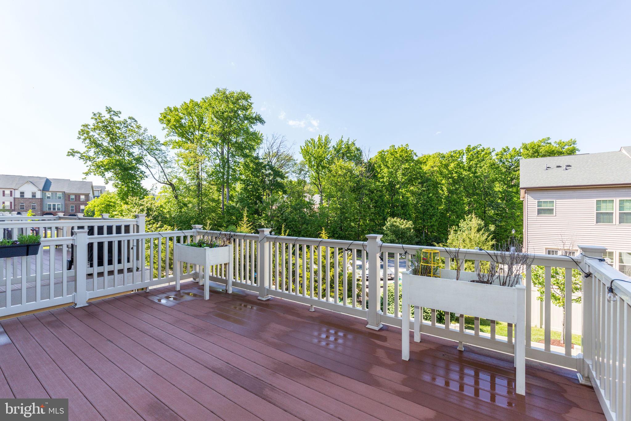 2784 Fredericksburg Road Hanover, MD 21076 - Photo 30 of 60 a view of a deck with two chair and wooden floor