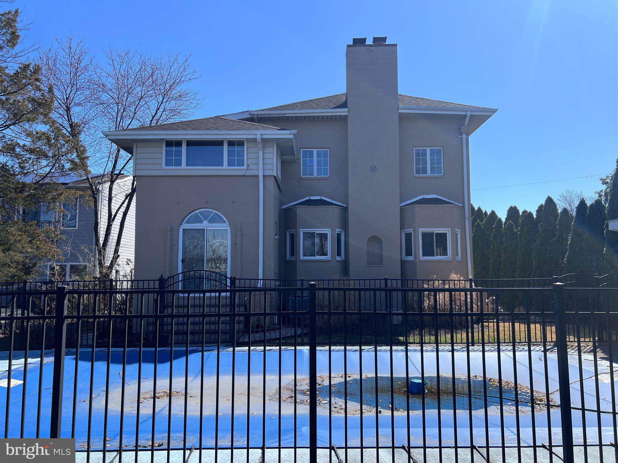 20 Granada Road Pasadena, MD 21122 - Photo 5 of 9 Elegant home with a serene pool view.