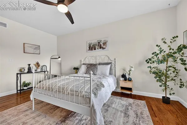 a bedroom with a bed and a table in it