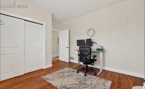 a view of workspace with wooden floor