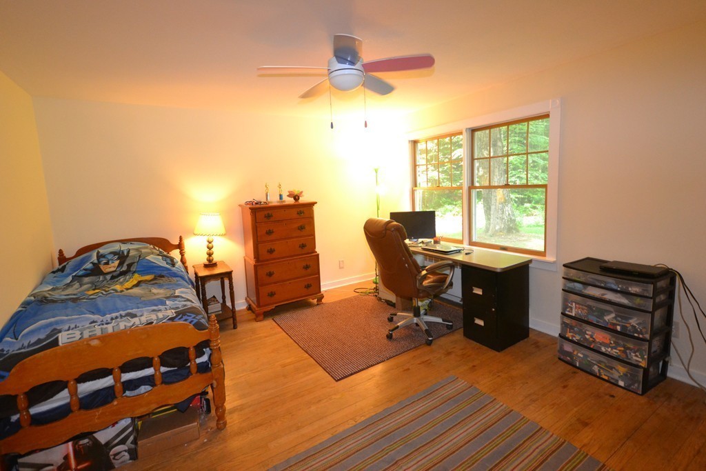 45 River Road Worthington, MA 01098 - Photo 11 of 28 a view of a workspace with furniture and a window