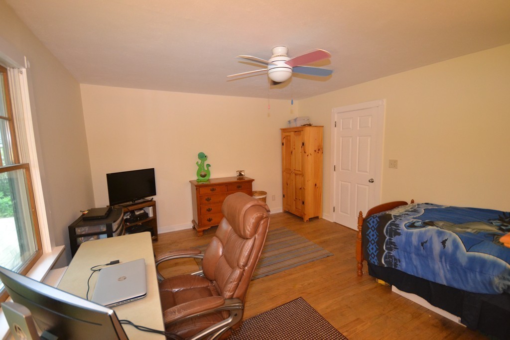 45 River Road Worthington, MA 01098 - Photo 15 of 28 a bed room with a bed and a television