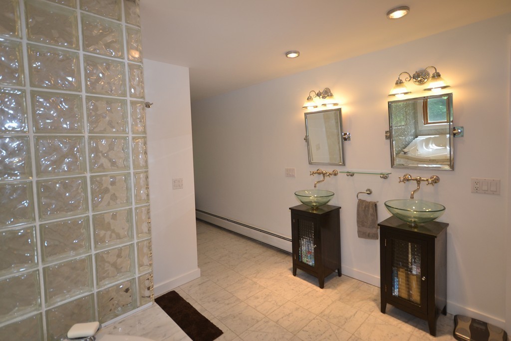 45 River Road Worthington, MA 01098 - Photo 19 of 28 a bathroom with a sink and a mirror