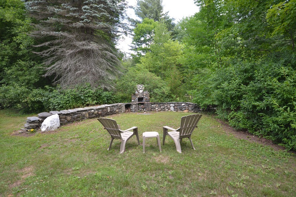 45 River Road Worthington, MA 01098 - Photo 4 of 28 a swimming pool with outdoor seating and yard