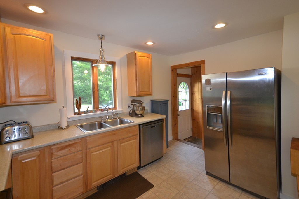 45 River Road Worthington, MA 01098 - Photo 5 of 28 a kitchen with stainless steel appliances granite countertop a refrigerator and a sink