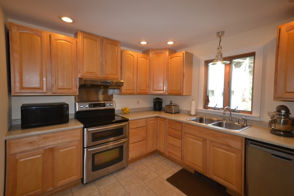 45 River Road Worthington, MA 01098 - Photo 6 of 28 a kitchen with a sink a stove and cabinets