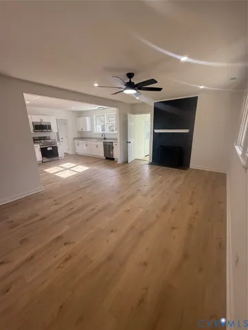 a view of an empty room with a window