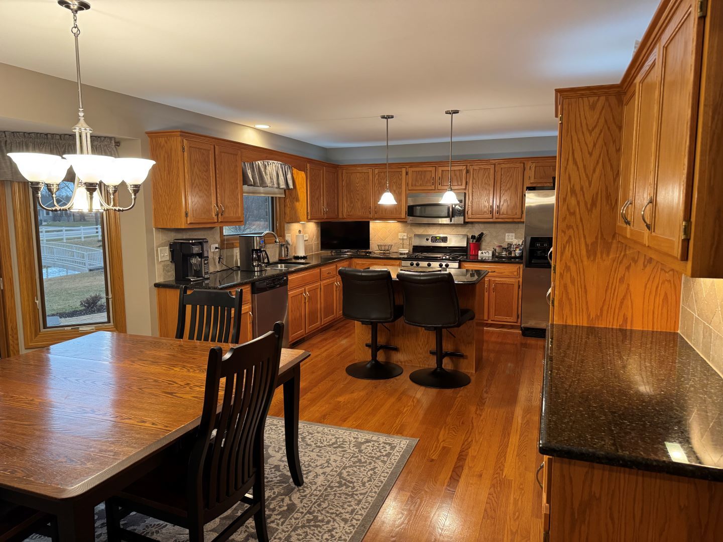 1397 O'Connell Circle New Lenox, IL 60451 - Photo 4 of 23 a view of a dining room with furniture window and wooden floor