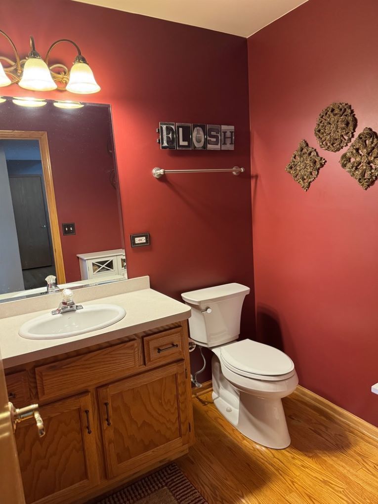 1397 O'Connell Circle New Lenox, IL 60451 - Photo 10 of 23 a bathroom with a toilet a sink and mirror