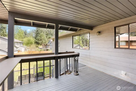 a view of a deck with wooden floor and outdoor space